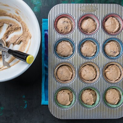 Scooped batter in muffin cups