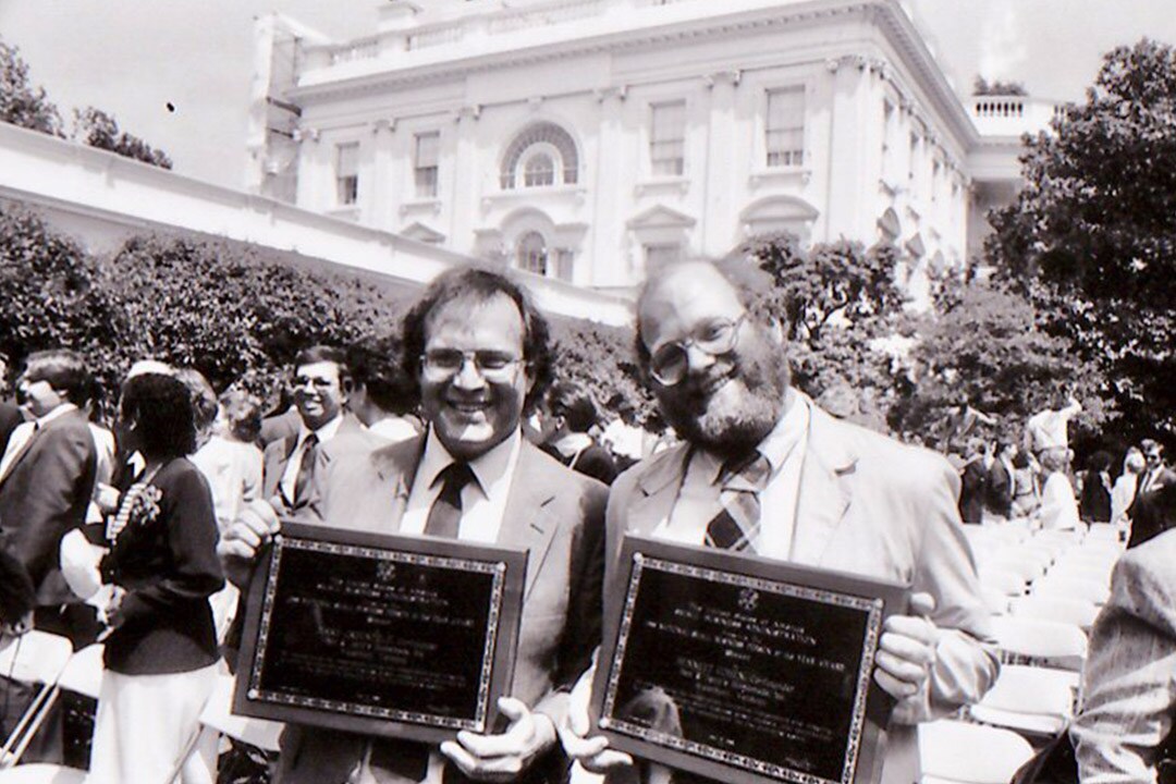 Ben & Jerry holding their award plagues