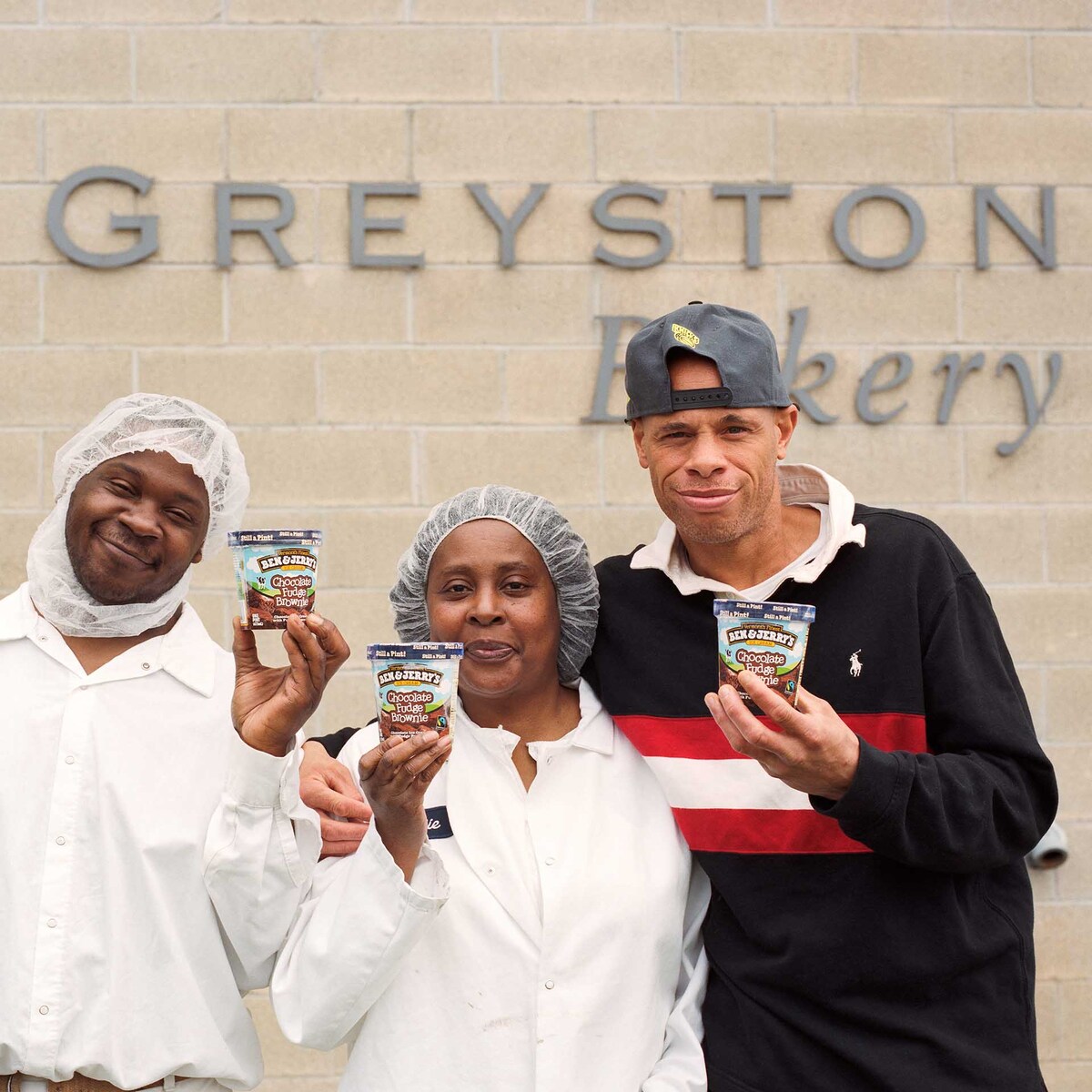 Greyston Bakery employees holding Ben & Jerry's ice cream pints